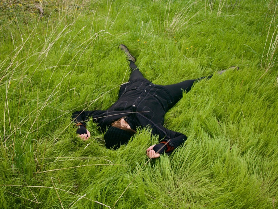 Person resting in grass for a natural health education article