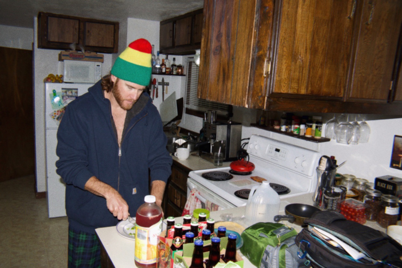 My friend Ross preparing food in his kitchen in his tiny house